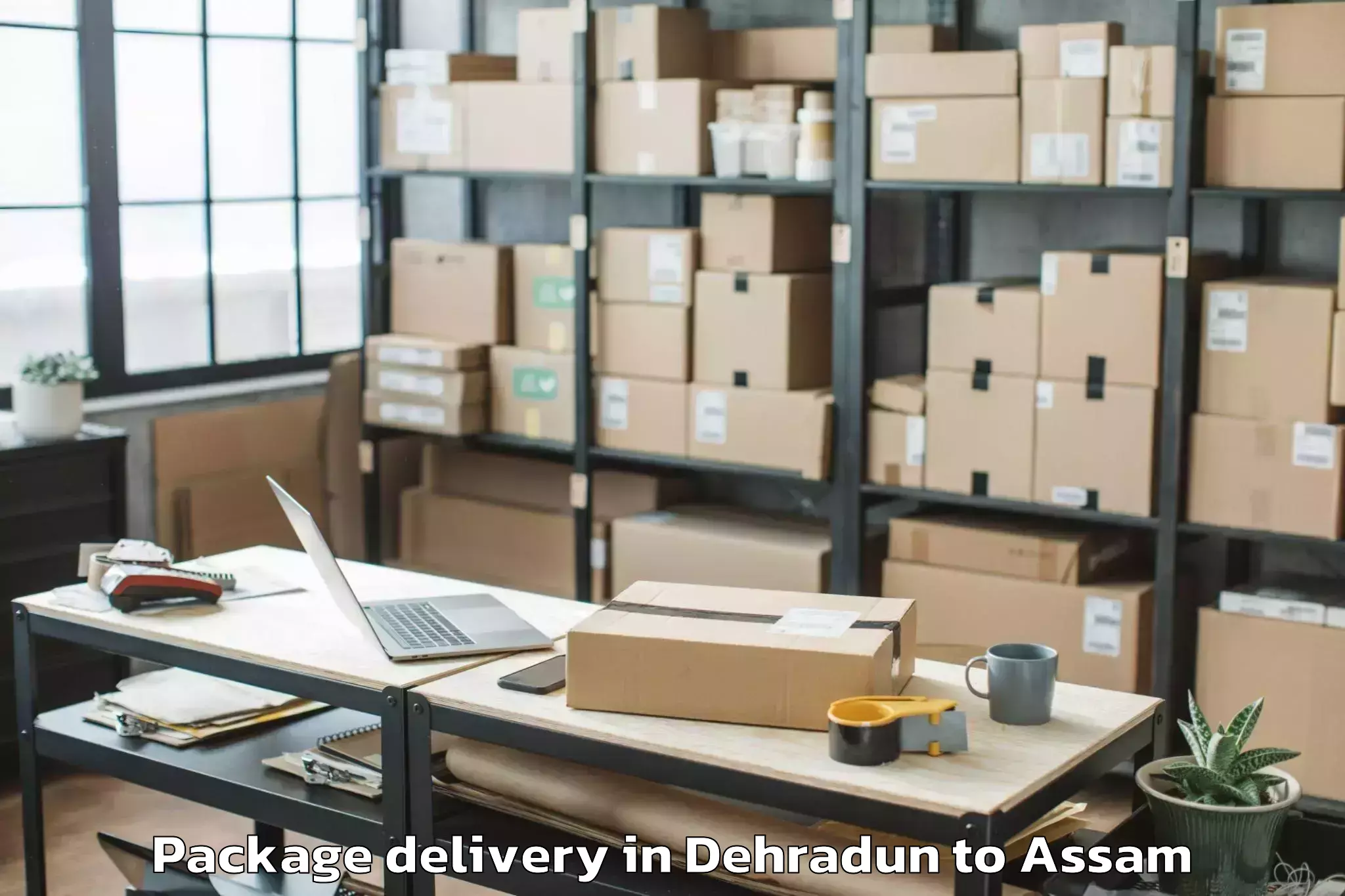 Reliable Dehradun to Raha Package Delivery